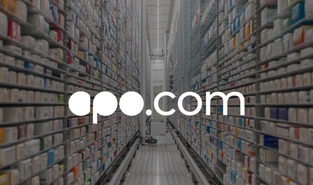 Automated pharmacy warehouse with apo.com logo.