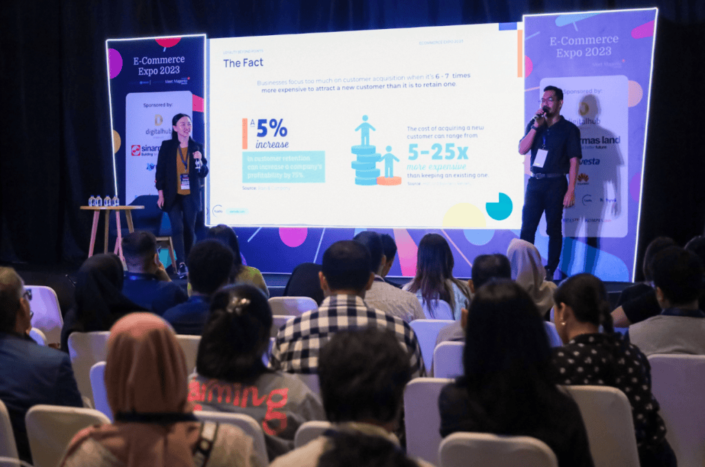 Speakers presenting on stage at E-Commerce Expo 2023.