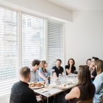 A group of people sharing a meal around a table.