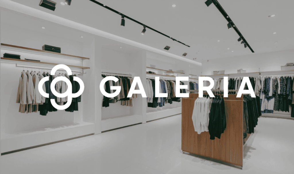 Modern minimalist clothing store interior with Galeria logo overlay.