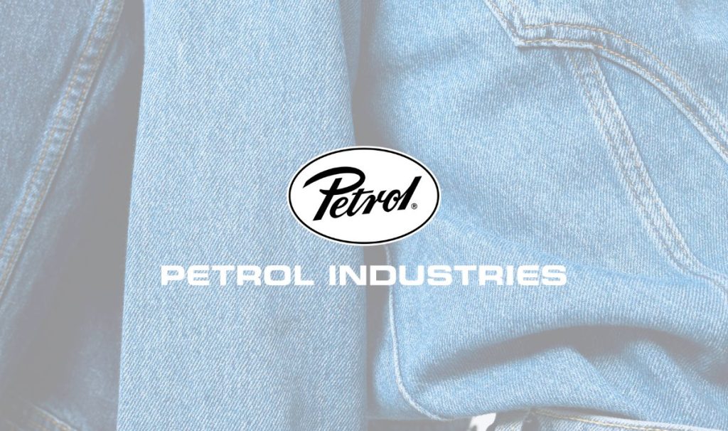 Petrol Industries brand logo over light blue denim fabric.