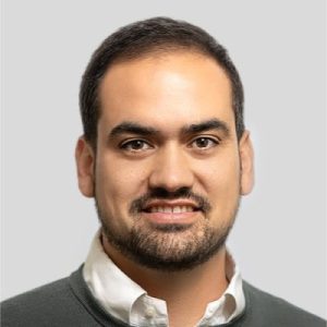 Headshot of a smiling man with a beard